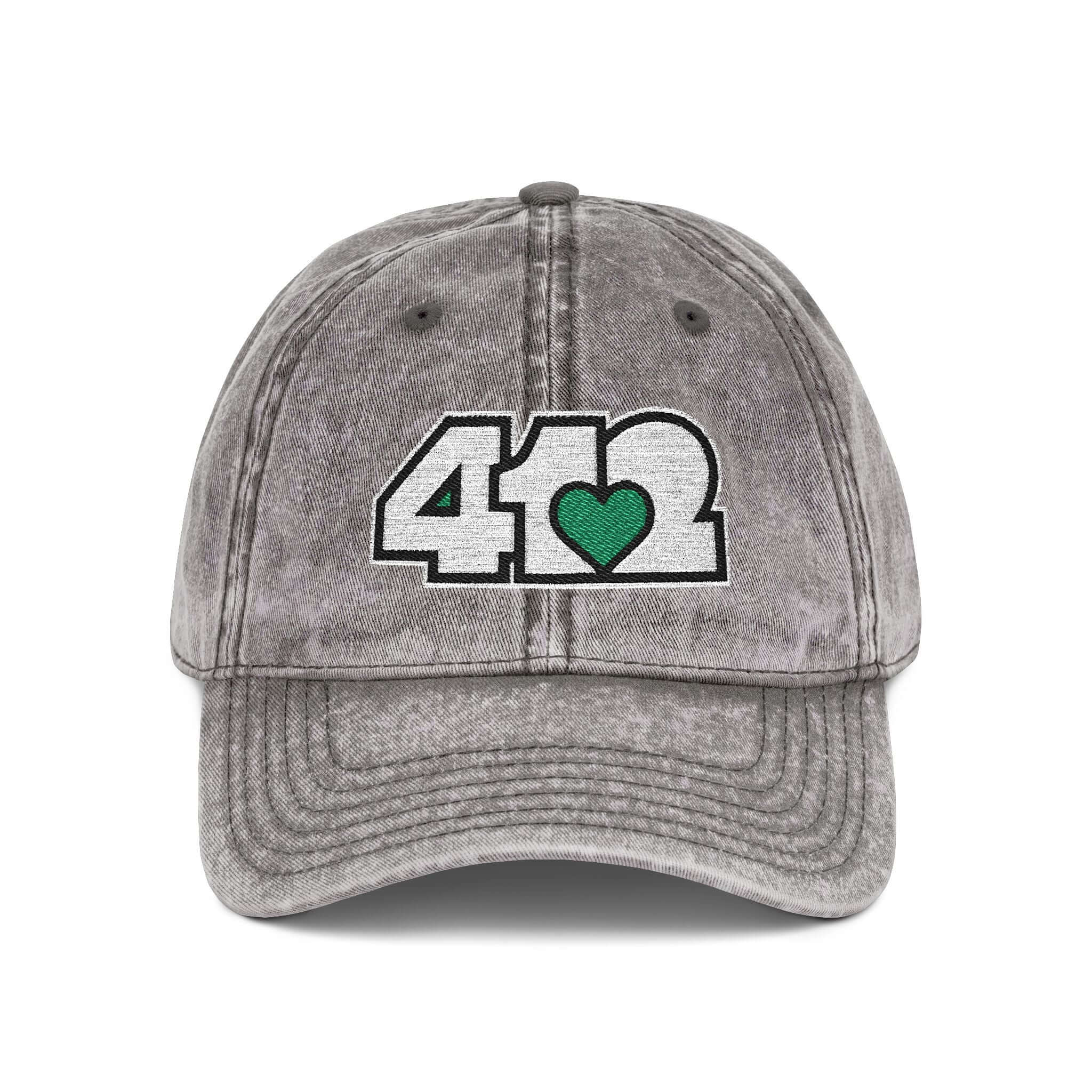 Pittsburgh Vintage Hat | Embroidered White and Green 412 Logo. Apparel Color: Charcoal Grey. A relaxed fit, cotton twill fabric, adjustable buckle, and washed-out finish look.
