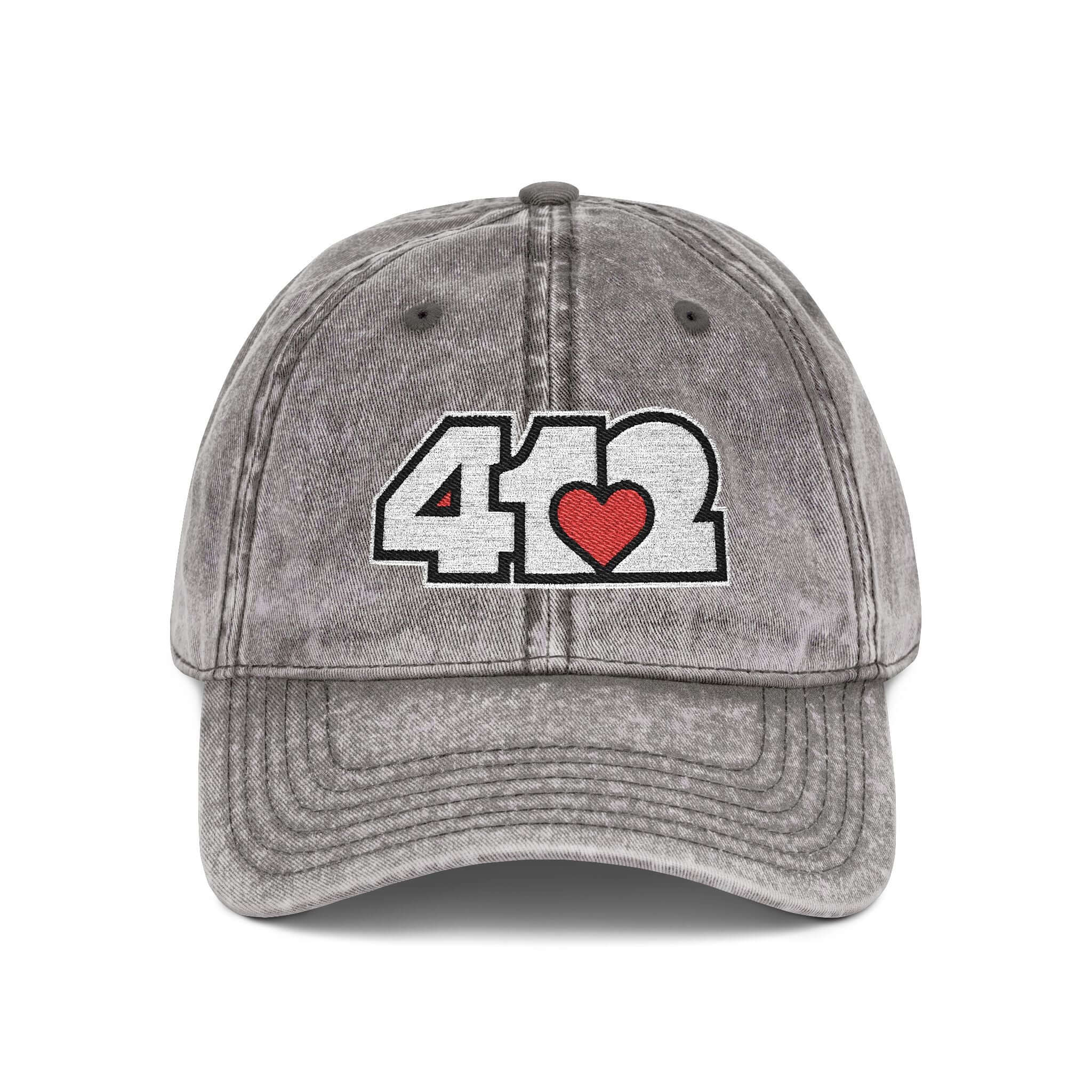 Pittsburgh Vintage Hat | Embroidered White and Red 412 Logo. Apparel Color: Charcoal Grey. A relaxed fit, cotton twill fabric, adjustable buckle, and washed-out finish look.