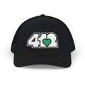 Snapback Hat | Embroidered White and Green 412 Logo. Apparel Color: Black. A comfy mid-profile adjustable fit for everyday flair