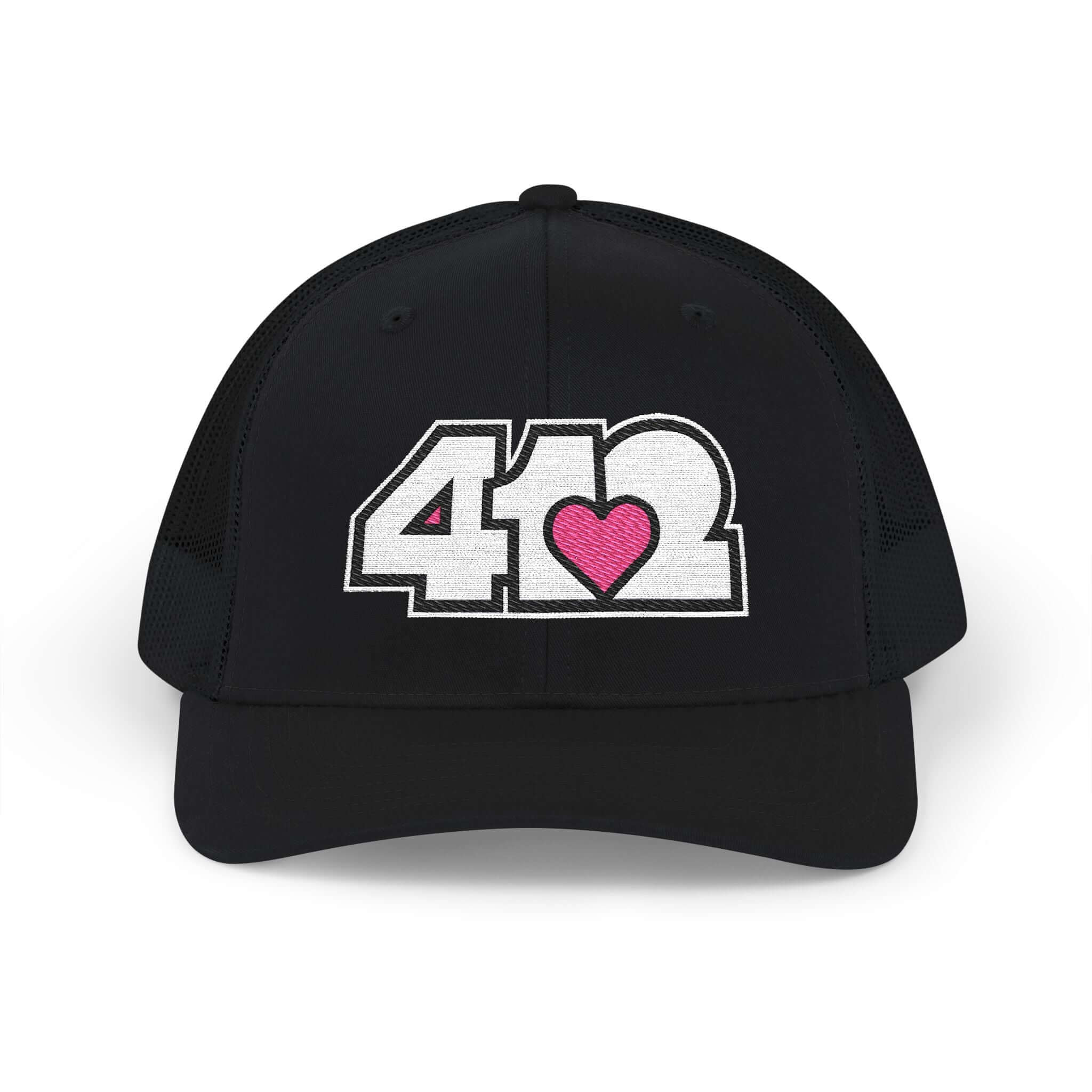 Snapback Hat | Embroidered White and Pink 412 Logo. Apparel Color: Black. A comfy mid-profile adjustable fit for everyday flair