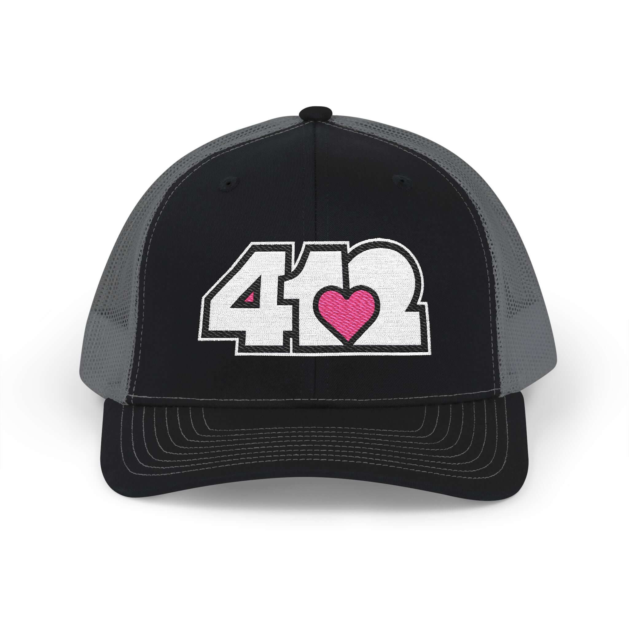 Snapback Hat | Embroidered White and Pink 412 Logo. Apparel Color: Black/Charcoal. A comfy mid-profile adjustable fit for everyday flair