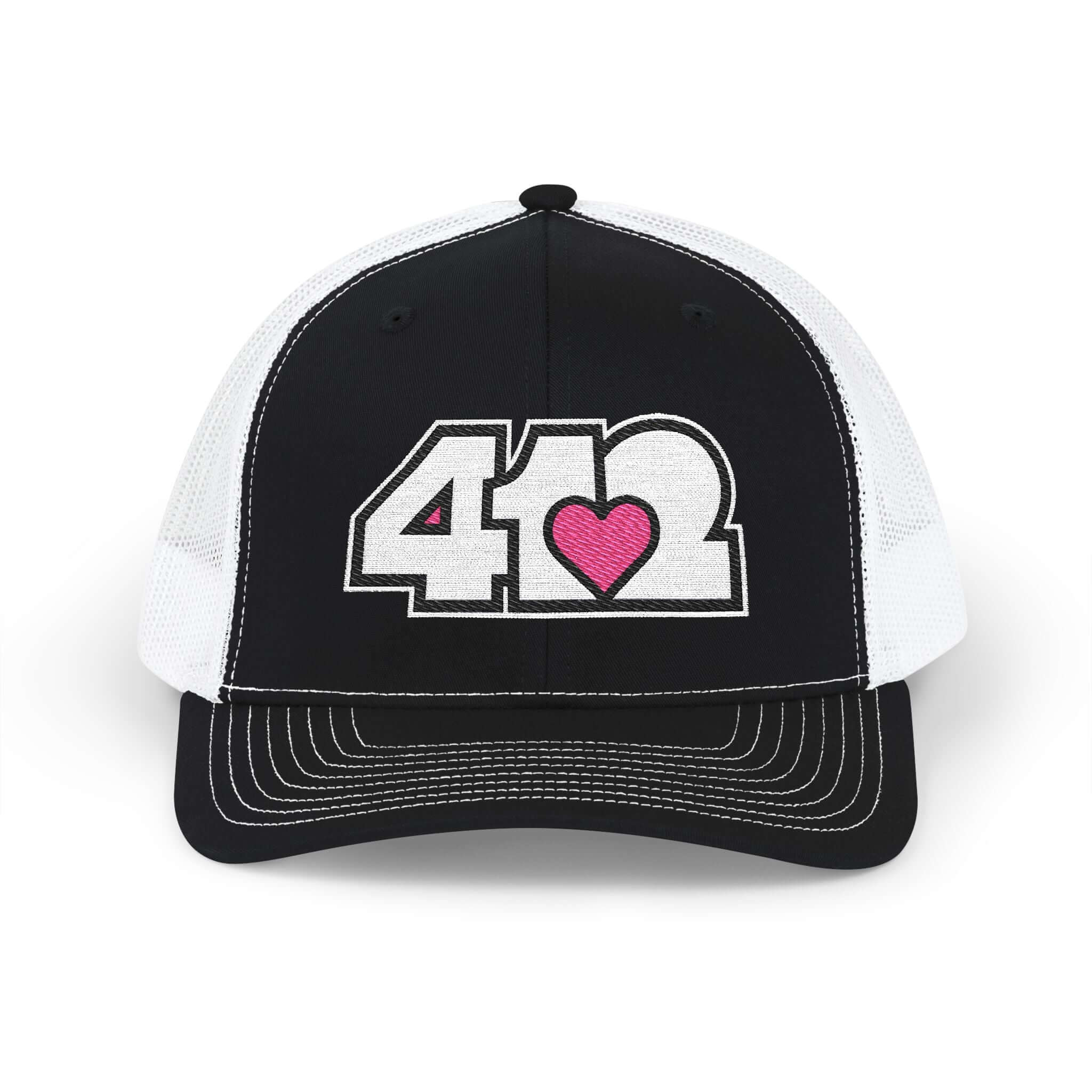 Snapback Hat | Embroidered White and Pink 412 Logo. Apparel Color: Black/White. A comfy mid-profile adjustable fit for everyday flair