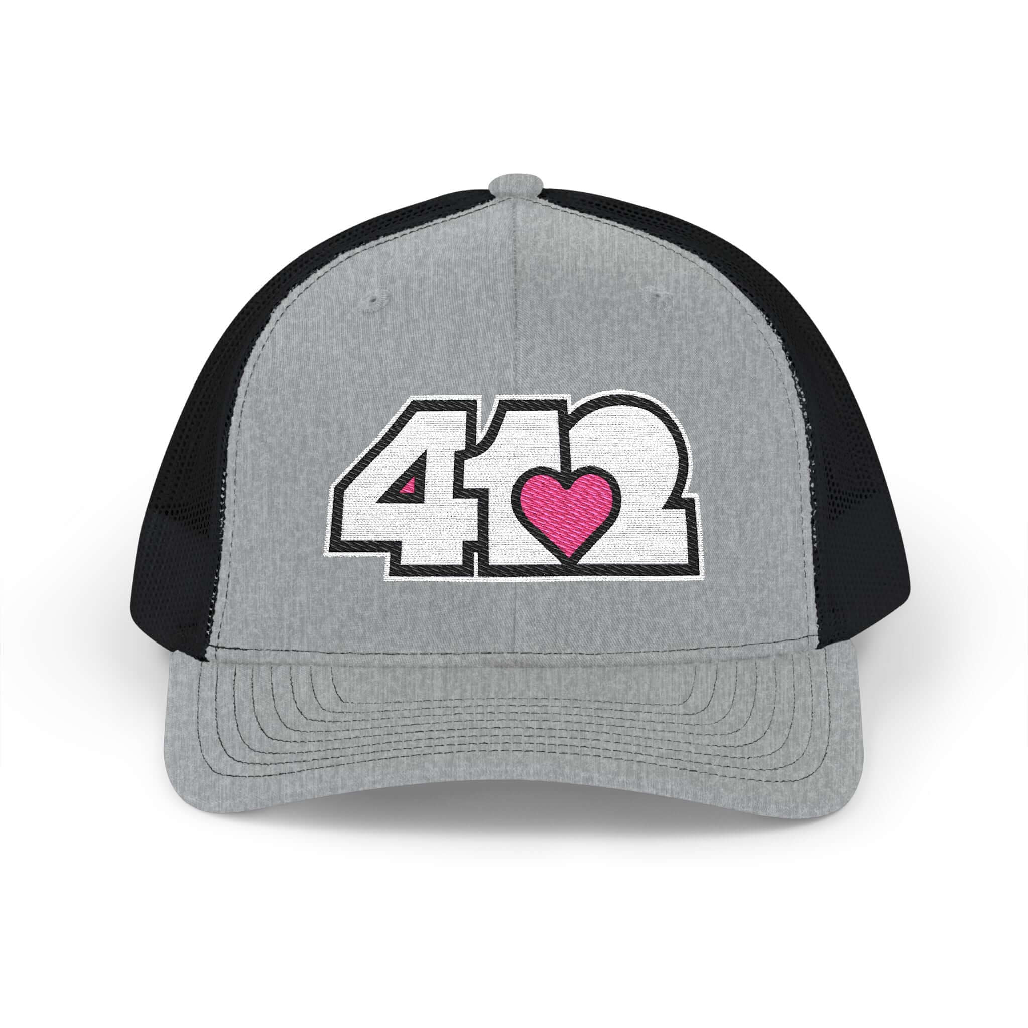 Snapback Hat | Embroidered White and Pink 412 Logo. Apparel Color: Heather Grey/Black. A comfy mid-profile adjustable fit for everyday flair