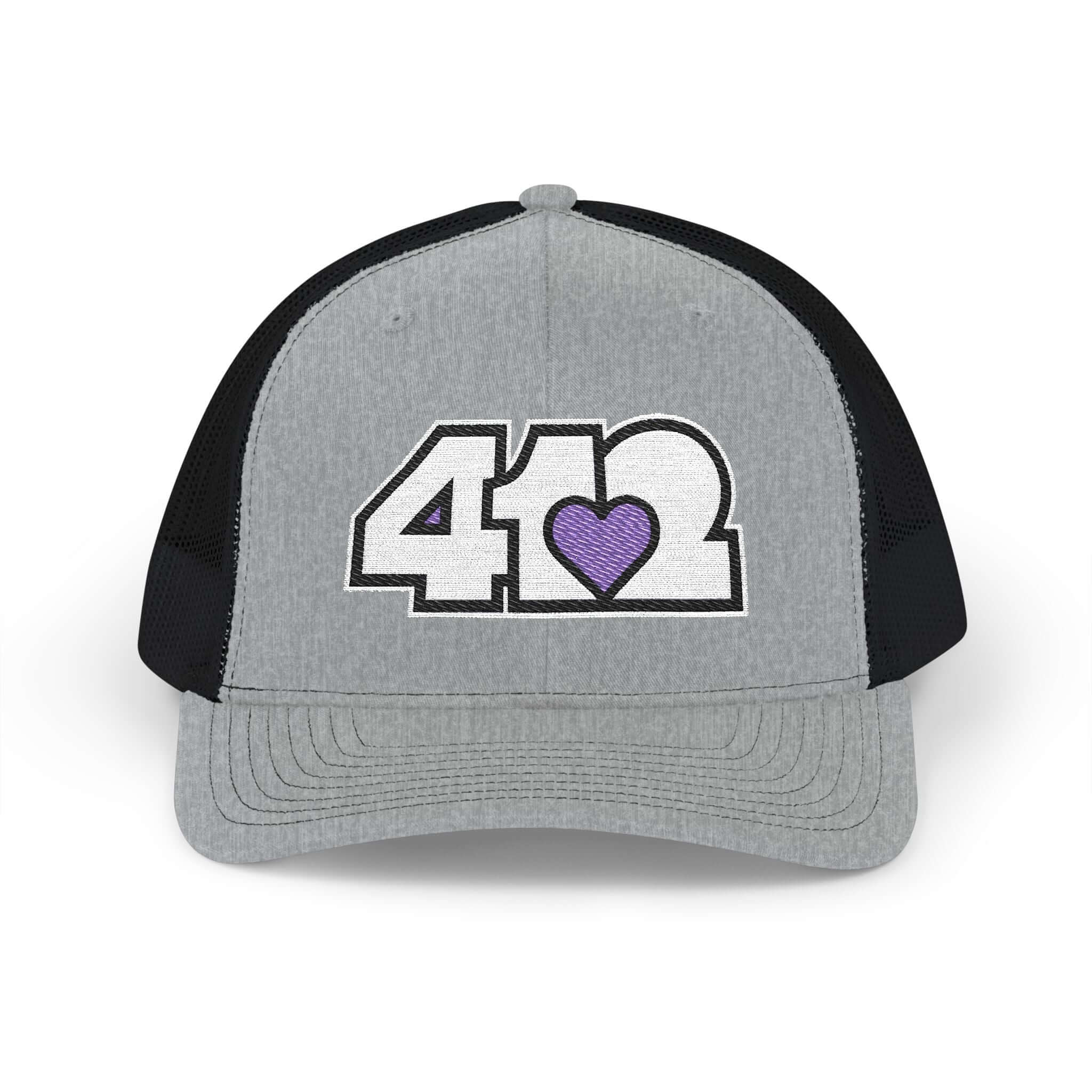 Snapback Hat | Embroidered White and Purple 412 Logo. Apparel Color: Heather Grey/Black. A comfy mid-profile adjustable fit for everyday flair