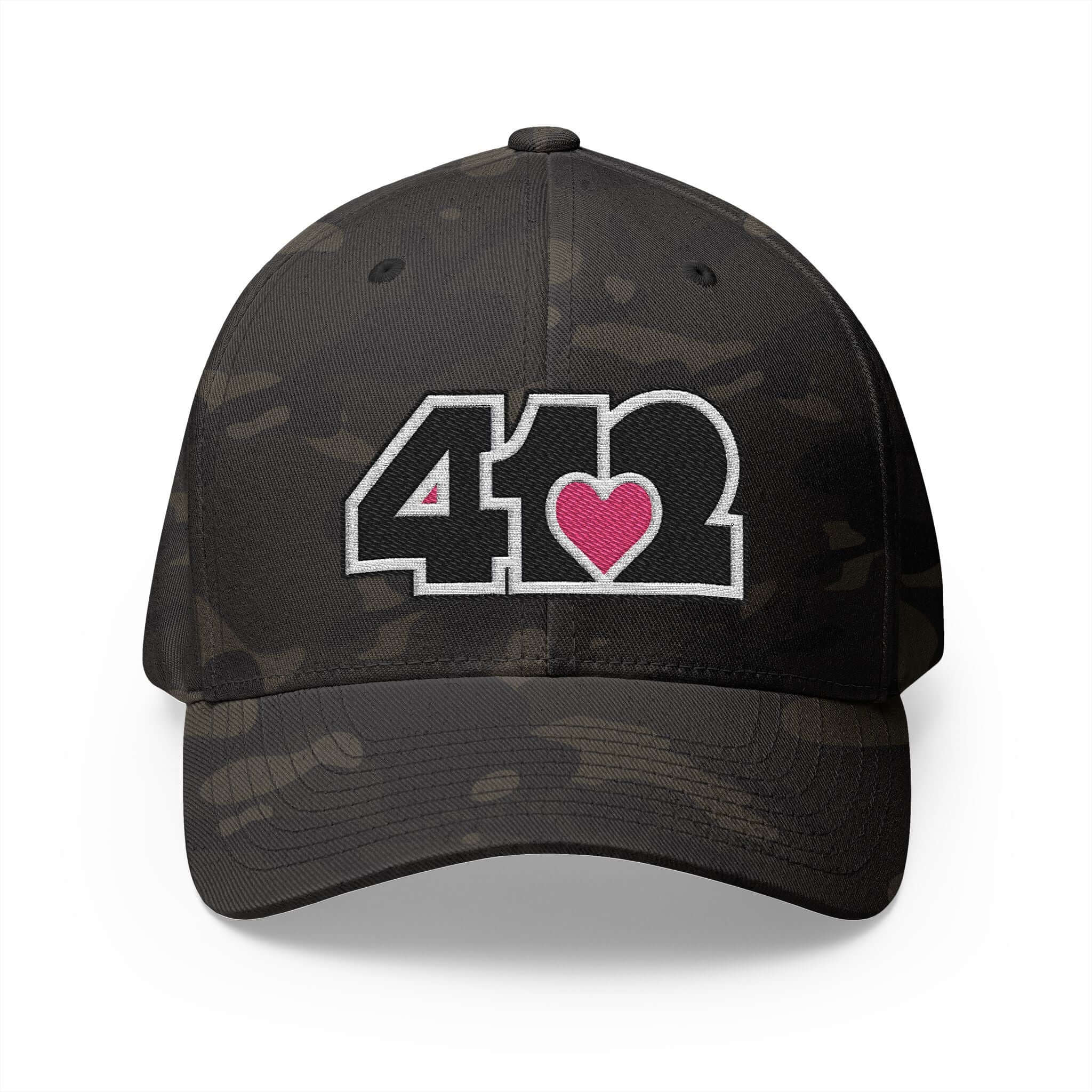 Stretch Fit Hat | Embroidered Black and Pink 412 Logo. Apparel Color: Multicam Black. The sleek design, featuring a mid-profile silhouette, and a curved visor.