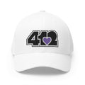 Stretch Fit Hat | Embroidered Black and Purple 412 Logo. Apparel Color: White. The sleek design, featuring a mid-profile silhouette, and a curved visor.