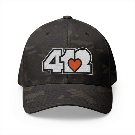 Stretch Fit Hat | Embroidered White and Orange 412 Logo. Apparel Color: Multicam Black. The sleek design, featuring a mid-profile silhouette, and a curved visor.