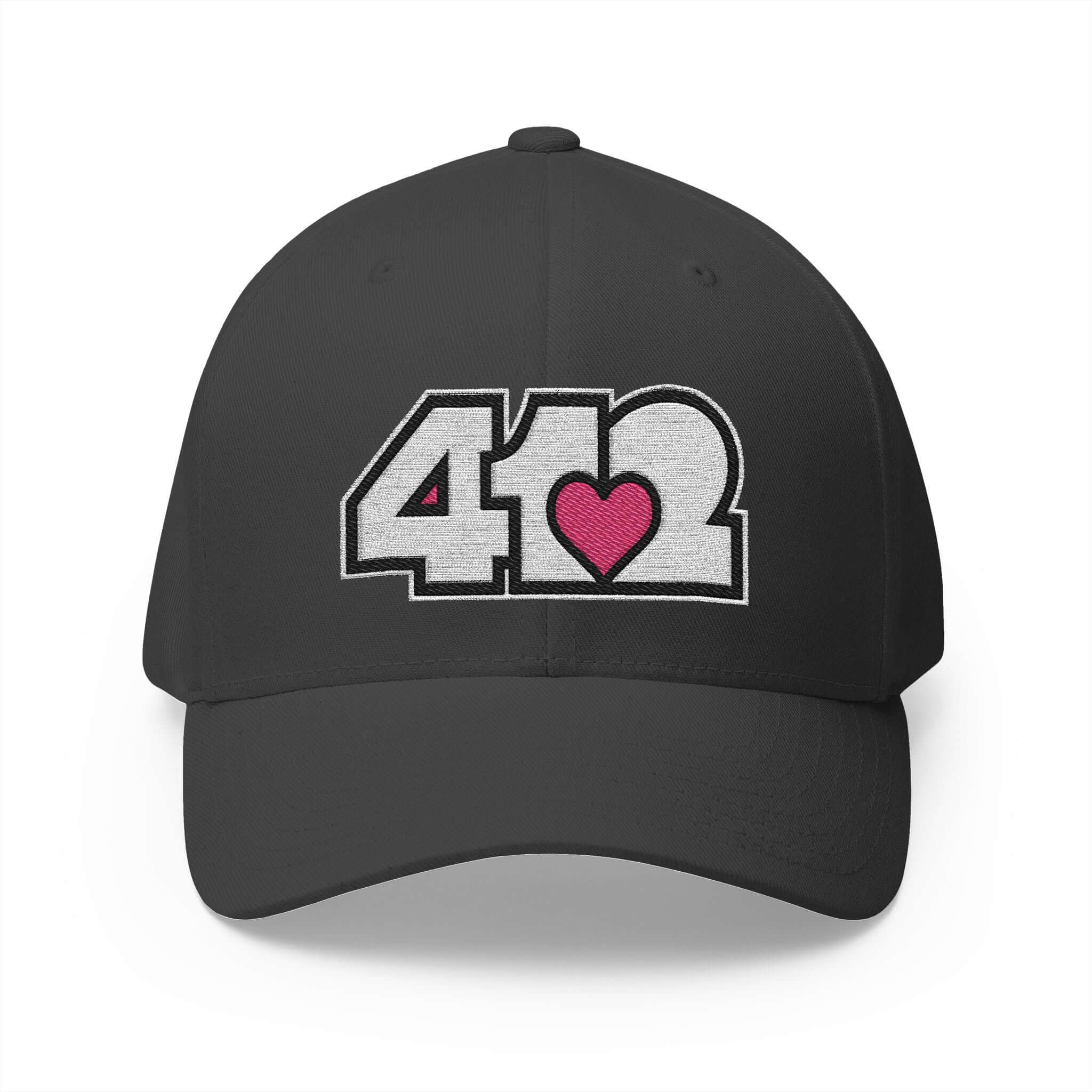Stretch Fit Hat | Embroidered White and Pink 412 Logo. Apparel Color: Dark Grey. The sleek design, featuring a mid-profile silhouette, and a curved visor.