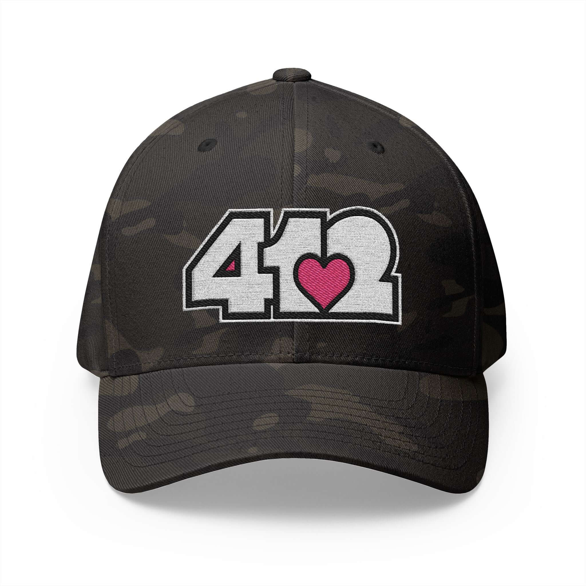 Stretch Fit Hat | Embroidered White and Pink 412 Logo. Apparel Color: Multicam Black. The sleek design, featuring a mid-profile silhouette, and a curved visor.