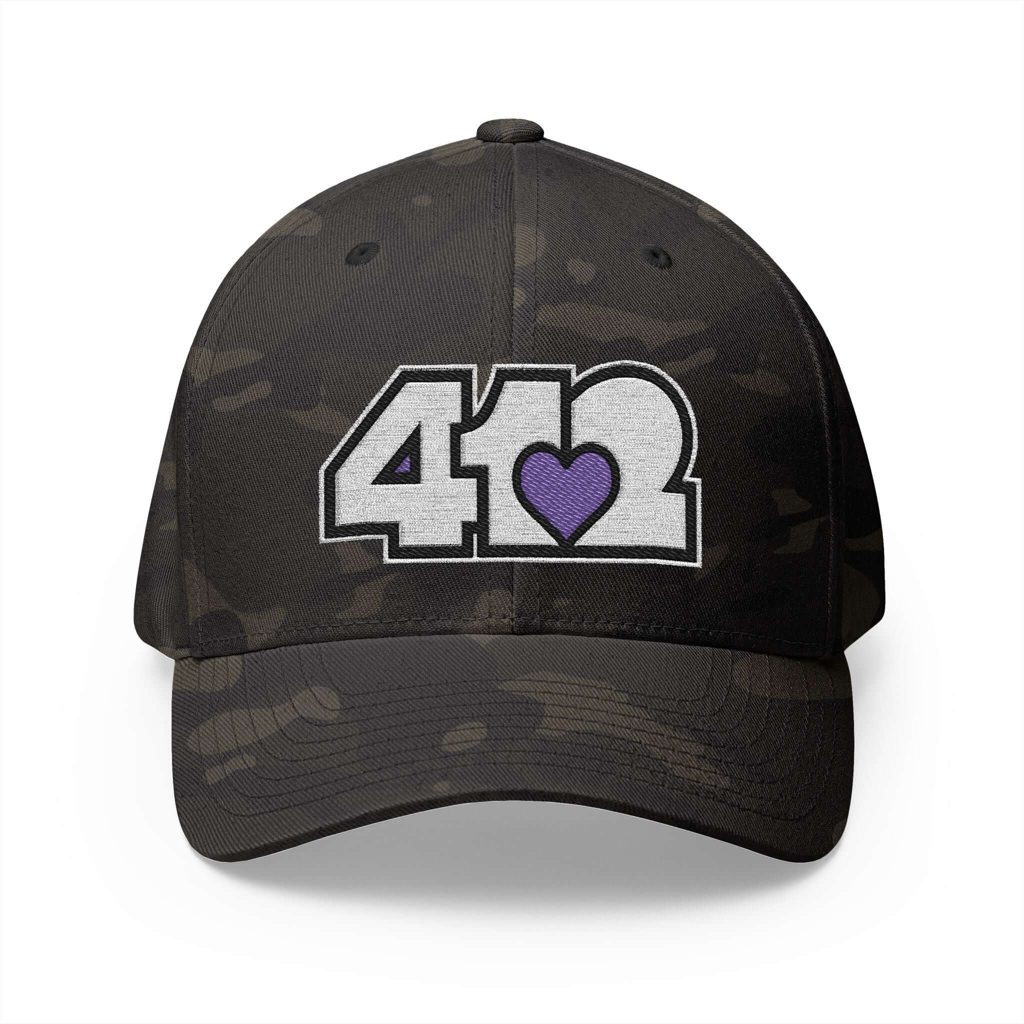 Stretch Fit Hat | Embroidered White and Purple 412 Logo. Apparel Color: Multicam Black. The sleek design, featuring a mid-profile silhouette, and a curved visor.