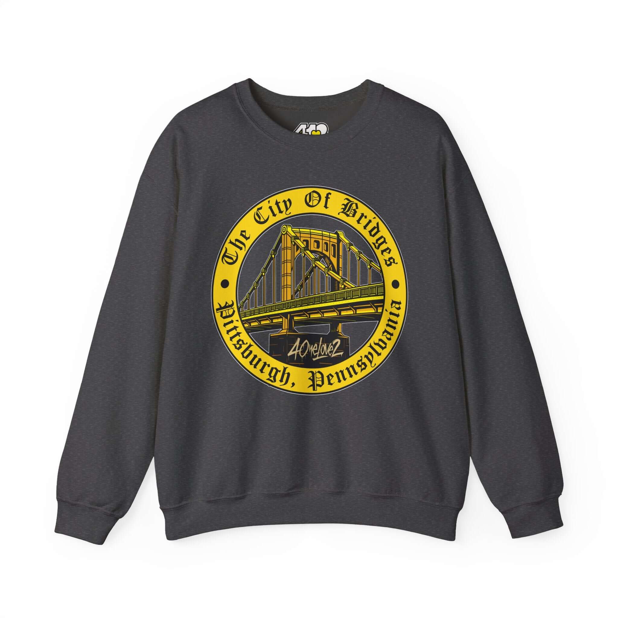 The City of Bridges Sweatshirt. Apparel Color: Dark Heather. A blend of 50% cotton and 50% polyester for cozy durability. With an Elastic ribbed collar, and Double-needle stitching.