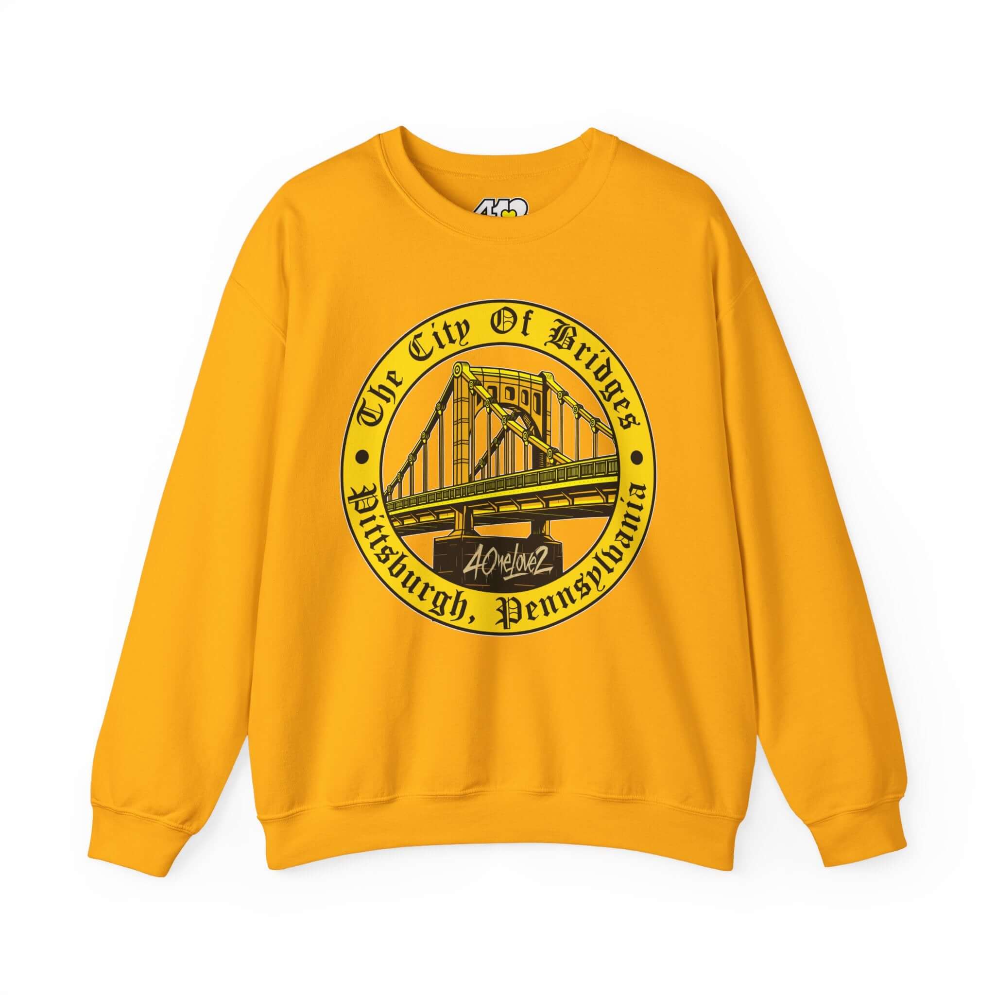 The City of Bridges Sweatshirt. Apparel Color: Gold. A blend of 50% cotton and 50% polyester for cozy durability. With an Elastic ribbed collar, and Double-needle stitching.