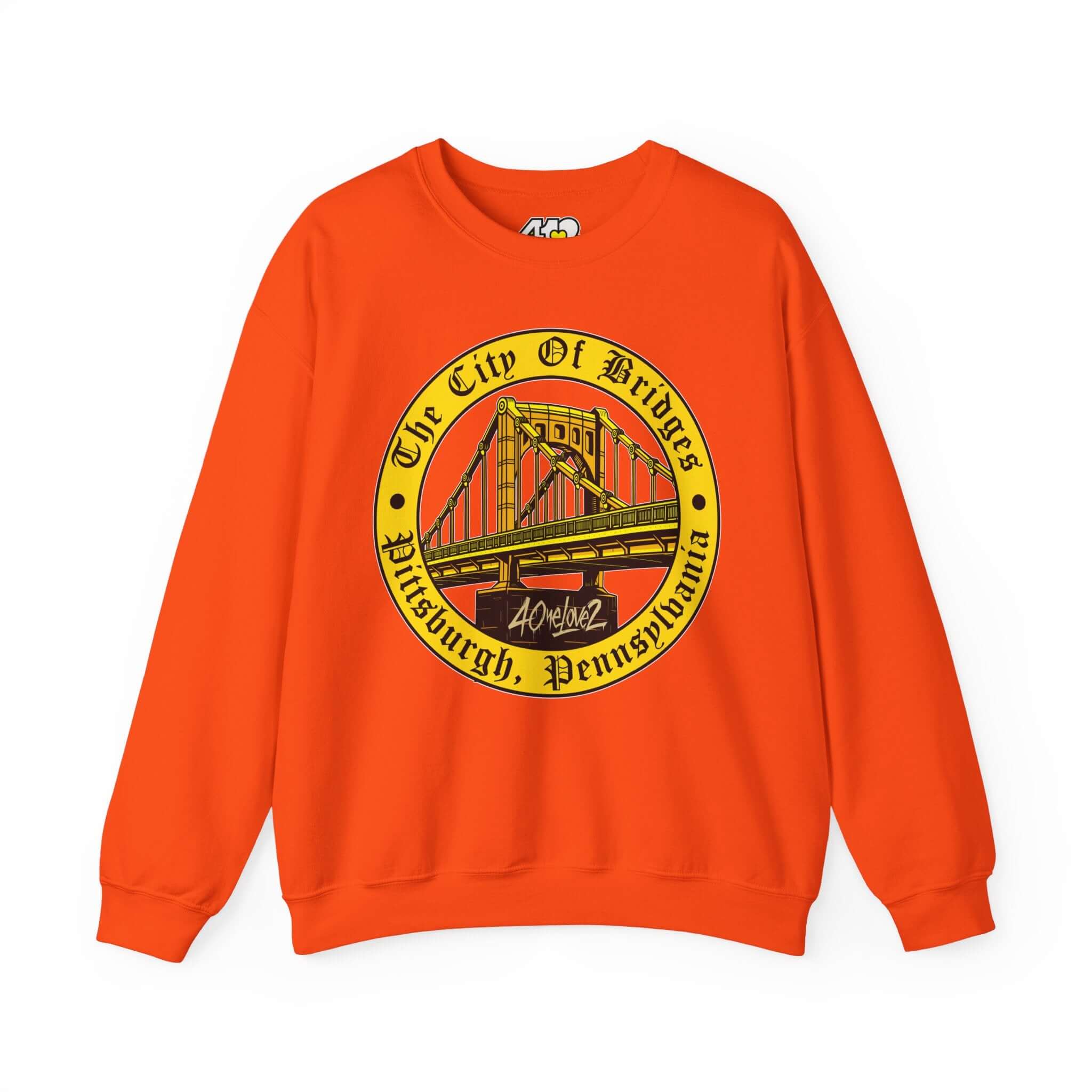 The City of Bridges Sweatshirt. Apparel Color: Orange. A blend of 50% cotton and 50% polyester for cozy durability. With an Elastic ribbed collar, and Double-needle stitching.